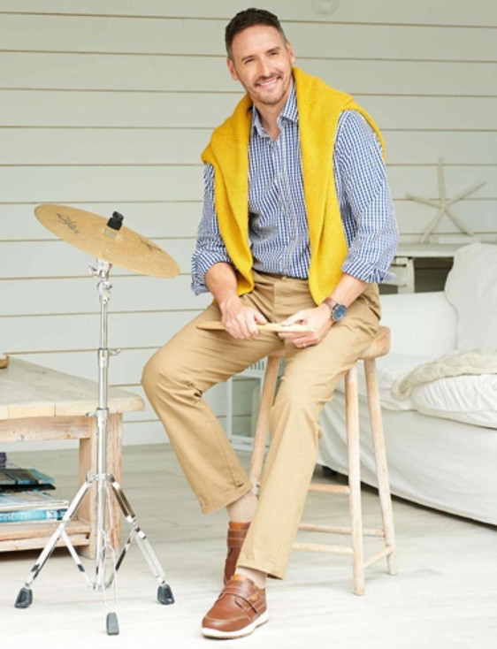 Man enjoying playing drums, supported by comfortable footwear