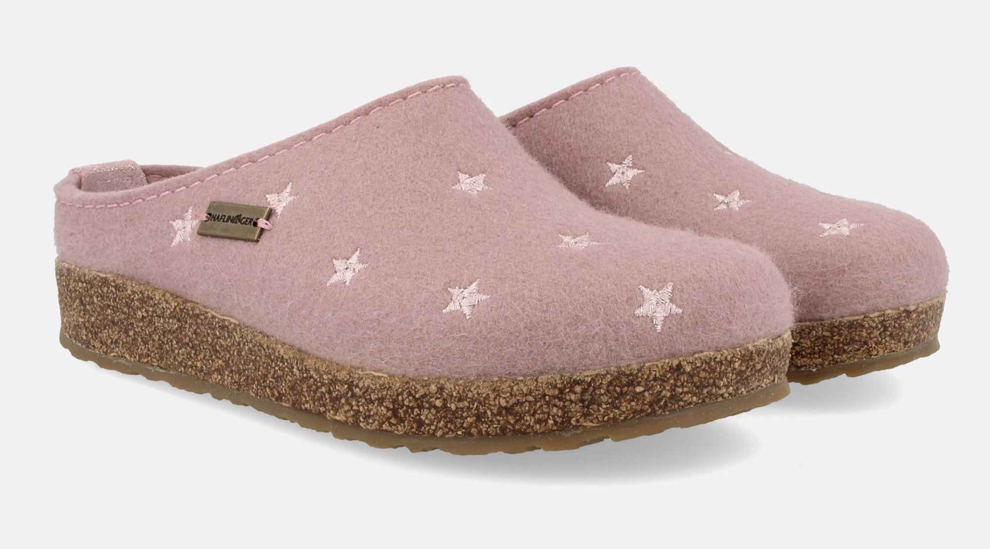 100% pure wool felt slippers from Haflinger featuring cork-latex, anatomically shaped footbeds to cushion your steps.